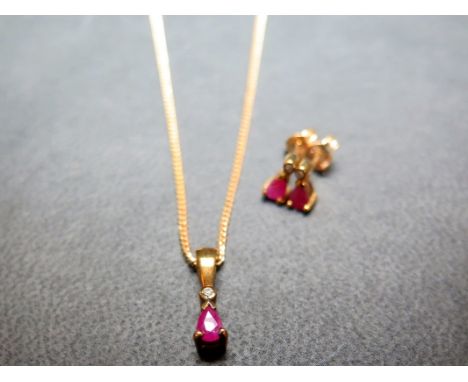 A set of ruby and diamond jewellery - To include a pear-shape ruby and single-cut diamond pendant, suspended from a curb-link