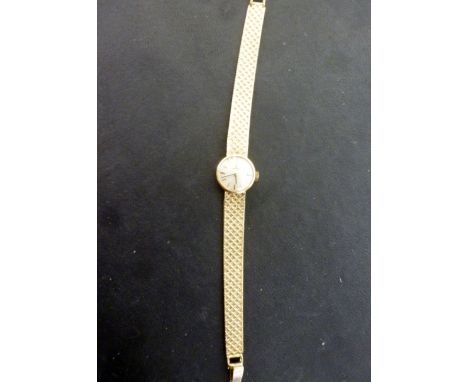 A 1950's Omega 9ct gold Ladies cocktail watch having metallic dial with stick markers and pencil hands, waffle weave bracelet