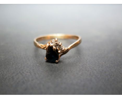 A 9ct gold sapphire and white-gem dress ring - Hallmarked London - Ring size L - Weight approx 1.5gms
Condition Report: Good 