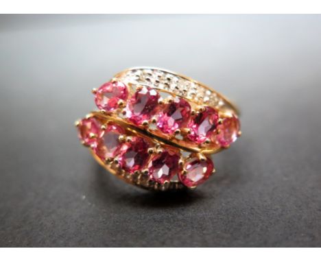 A 9ct gold pink-gem and diamond dress ring - Hallmark obscure - Ring size P - Weight approx 3.7gms
Condition Report: Good 