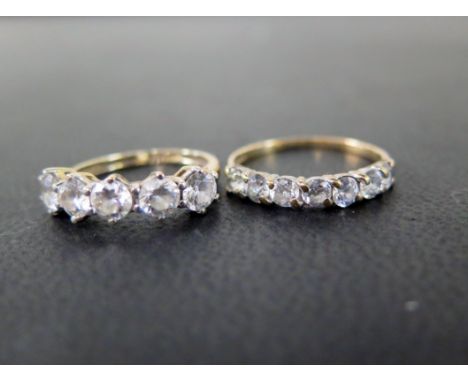 Two cubic zirconia half-circle rings - With marks indicating 9ct gold - Ring sizes H 1/2 and M - Weight approx 2.8gms
Conditi
