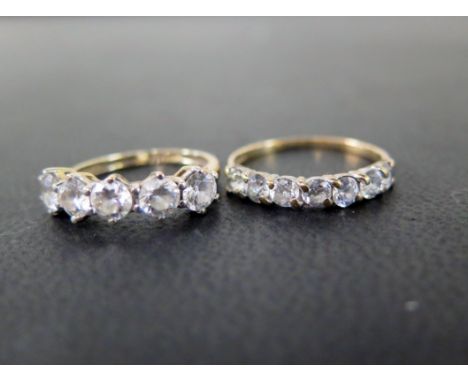 Two cubic zirconia half-circle rings - With marks indicating 9ct gold - Ring sizes H 1/2 and M - Weight approx 2.8gms
Conditi