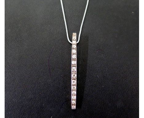 A diamond pendant - The old-cut diamond line, suspended from a coil-link chain - Estimated total diamond weight 1.20cts - Pen