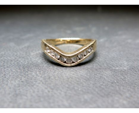 A 9ct gold diamond chevron-shape ring - Diamond weight 0.25ct, stamped to band - Hallmarked Sheffield - Ring size L 1/2 - Wei