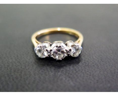 A brilliant-cut diamond three-stone ring - Estimated total diamond weight 0.80ct - Estimated I-K colour, VS clarity - Stamped