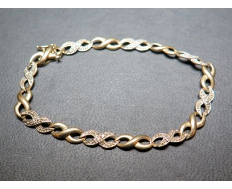 A 9ct gold openwork panel bracelet with diamond highlights - Hallmarked Sheffield - Length 19cms - Weight approx 5.8gms
Condi
