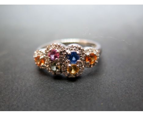A diamond and multi-gem cluster dress ring - Stamped 9ct - Ring size P 1/2 - Weight approx 3.5gms
Condition Report: Good