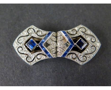 A striking 1930's platinum diamond and sapphire metamorphic brooch/dress clips of mitre shape form with small eight and rose-