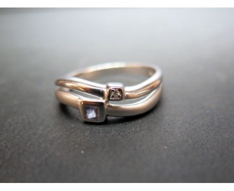 A tanzanite and diamond curved band ring - Hallmarked Sheffield - Ring size R - Weight approx 3.2gms
Condition Report: Good