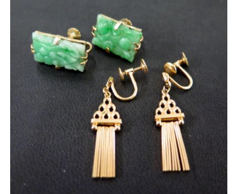 A pair of rolled gold tassel ear clips - Length 3.3cms - Together with a pair of carved jade panel earrings - Length 1.8cms -