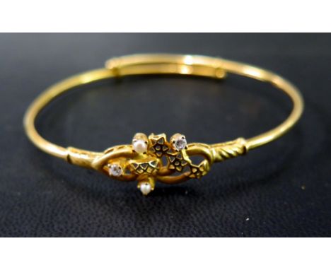 A seed pearl and white-gem bangle - Stamped 22K - Inner diameter approx 6.5cms - Weight approx 8.2gms
Condition Report: Good 