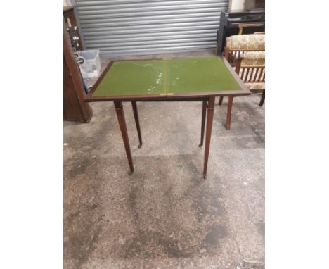 Mahogany fold over card table on brass castors 