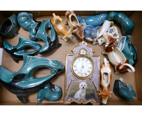 A collection of Poole pottery animals to include Dolphins, otters together with cow creamers , Bradex limited edition mantle 