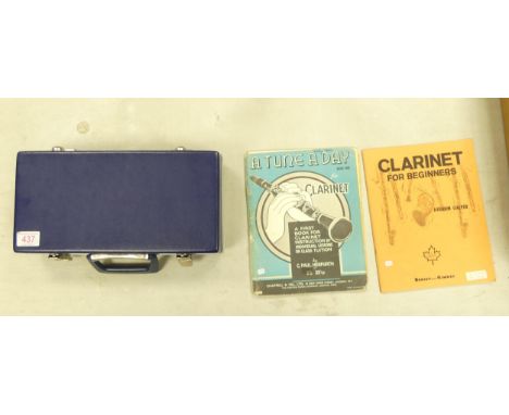 A Boosey &amp; Hawkes clarinet, in case with books (3) 