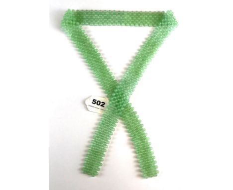 A polished jade bead tying necklace, L. 95cm.