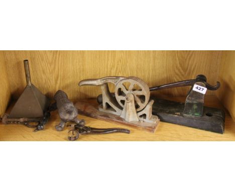 An antique bar top cork remover, cork roller, animal cork press and other wine related items.