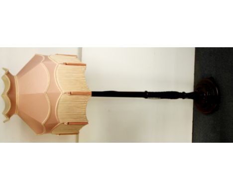 A mahogany standard lamp and shade.