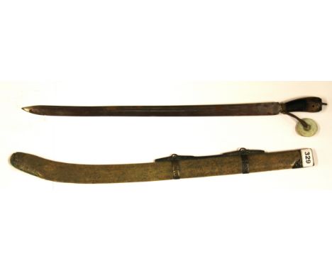 A Chinese sword with wooden hilt, shagreen scabbard and glass (imitating jade) disc, L. 69cm.