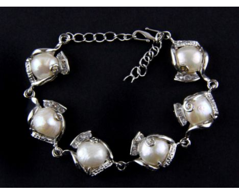 A white metal and baroque pearl bracelet.