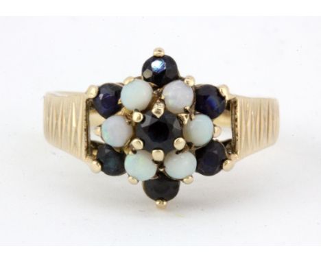 A 9ct yellow gold opal and sapphire set cluster ring, (N.5).