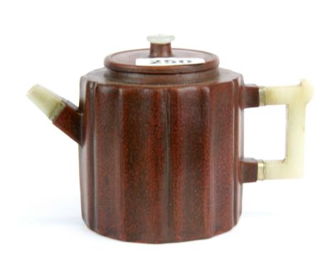 A Chinese Yixing terracotta teapot with jade spout and handle, H. 11cm spout to handle W. 17cm.