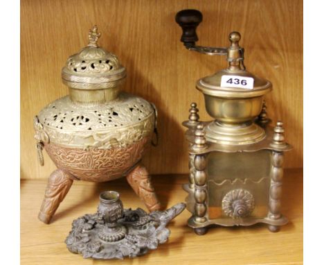 A brass coffee grinder, chamberstick and censer.
