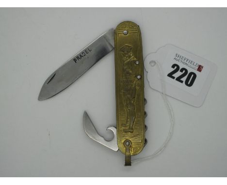 A Pocket Knife, made by Pradel with brass scales depicting gamesmen with shotgun and hunting dog to the reverse, two blades a