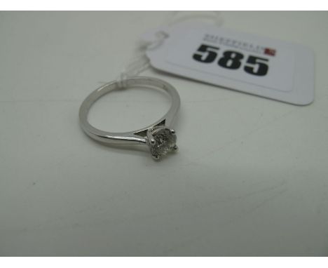 A Modern Single Stone Diamond Ring, the brilliant cut stone claw set between tapered shoulders, stamped "750" "52" (finger si