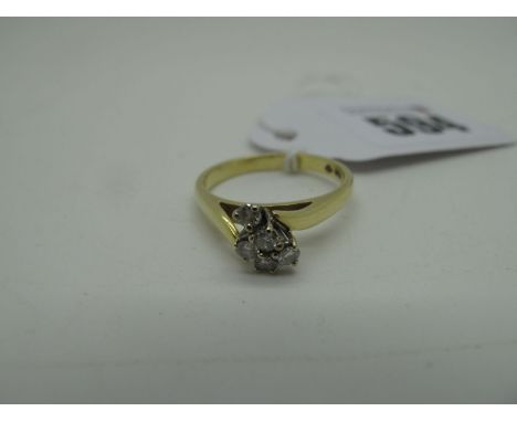 A Five Stone Diamond Ring, of abstract deign, claw set throughout with brilliant cut stones, stamped "750" (finger size O1/2)