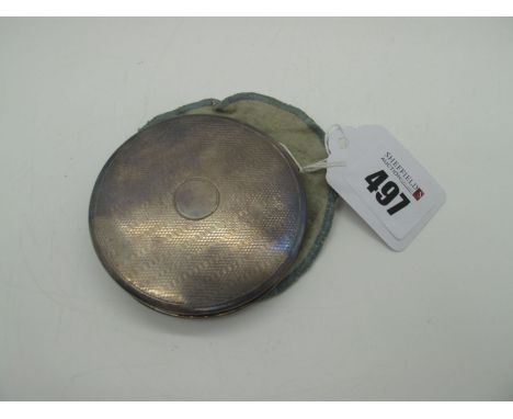 A Circular Powder Compact, with engine turned decoration, with internal mirror, stamped "Silver", 7.3cm diameter. 