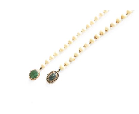 A Cultured Pearl Necklace, the clasp set centrally with an oval nephrite within a Greek key border, length 59.5cm (a.f); and 