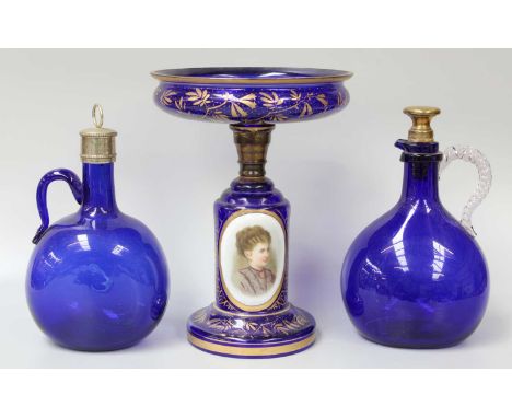 A Bohemian Bristol Blue Glass Tazza, late 19th century, decorated with a portrait and gilded together with two similar decant