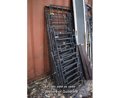 LARGE RUN COMPRISING NINE SECTIONS OF DECORATIVE WROUGHT IRON RAILING