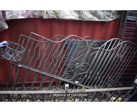 TWO MATCHING SUBSTANTIAL DECORATIVE WROUGHT IRON ANGLED RAILING SECTIONS, COMPLETE WITH DECORATIVE BASKET, EACH 1940 X 1400