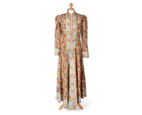 Circa 1930/40s Indian Crewelwork Housecoat, densely embroidered allover with a vibrant floral design, on a cream ground, the 