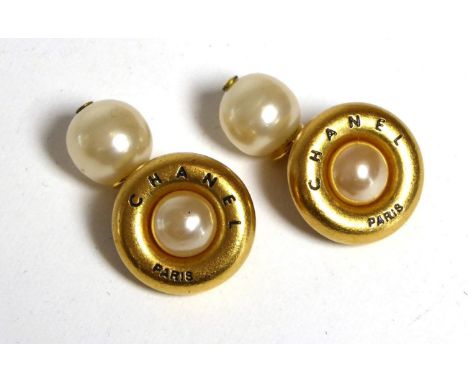 A Pair of Chanel Cufflinks, simulated pearls within gilt metal borders signed 'CHANEL Paris', chain linked to simulated pearl