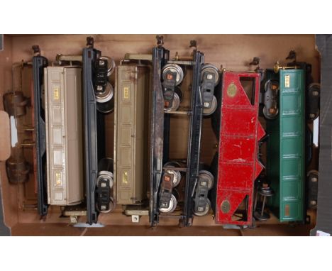 6 x Lionel GI bogie wagons including flat with 2 search lights, 2 x side tipper no.218, flat for timber no.211, Hopper with c