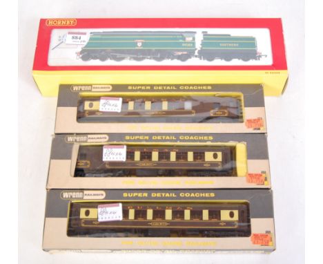 A Hornby R2219 SR malachite green West Country class engine and tender 'Blackmoor Vale' (G-BFG) and sold with 3 Wrenn Pullman