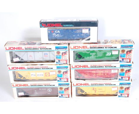 7 assorted Lionel plastic bogie wagons including grey Union Pacific hopper, green Burlington covered hopper, red Delaware and