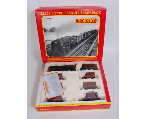 A Hornby R2139 'Fitted Freight' train pack containing class 9F engine and tender No. 92099, 5 fitted vans, and brake van, all
