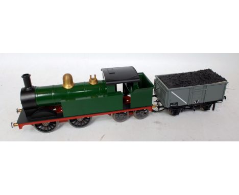 Gauge 1 0-4-0 tank loco by Dee with can motor coupled to a Bachmann China Mineral wagon (with coal) containing electric contr