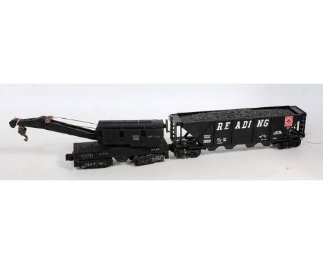 Lionel Lines black 12 wheel plastic breakdown crane no. 2460 (G) with a bogie "Reading" hopper with coal load (NM)