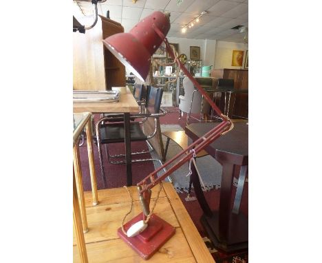 A vintage red Herbert Terry & Sons Anglepoise lamp, with maker's mark 