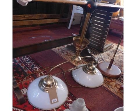 A brass two branch billiards ceiling light with white shades 