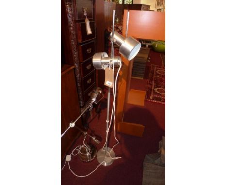 A chrome two light standard lamp, on circular base 