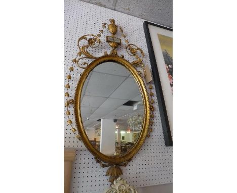 A 19th century oval giltwood pier mirror, with urn finial, 105x53cm 