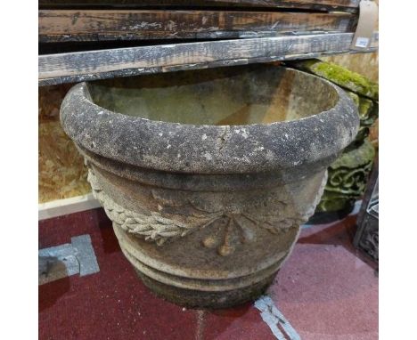 A large tapering reconstituted stone garden planter with Classical swag decoration, H.45cm 