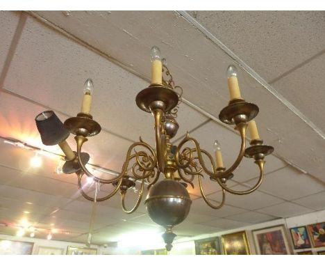 A contemporary brass eight branch chandelier 