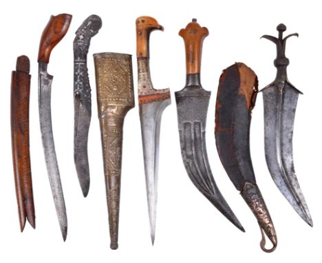 λ India and proximate regions: a small group of edged weapons, comprising: a Chilanum, all steel, curved blade of Arab type, 