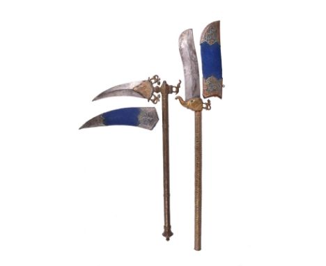  Two Indian mele weapons: a bhuj, stout double curved blade 7.5 in, mounted on a brass elephant head with green glass eyes, b